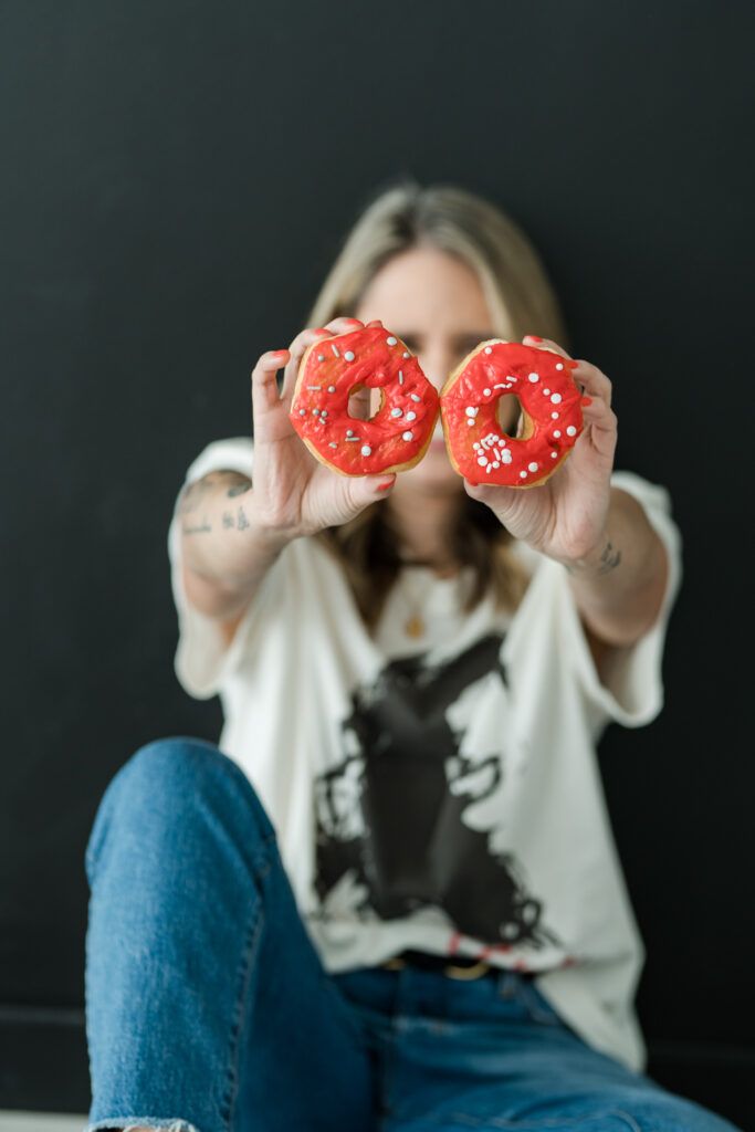 photos of brand designer Natalia Gaitan holding donuts