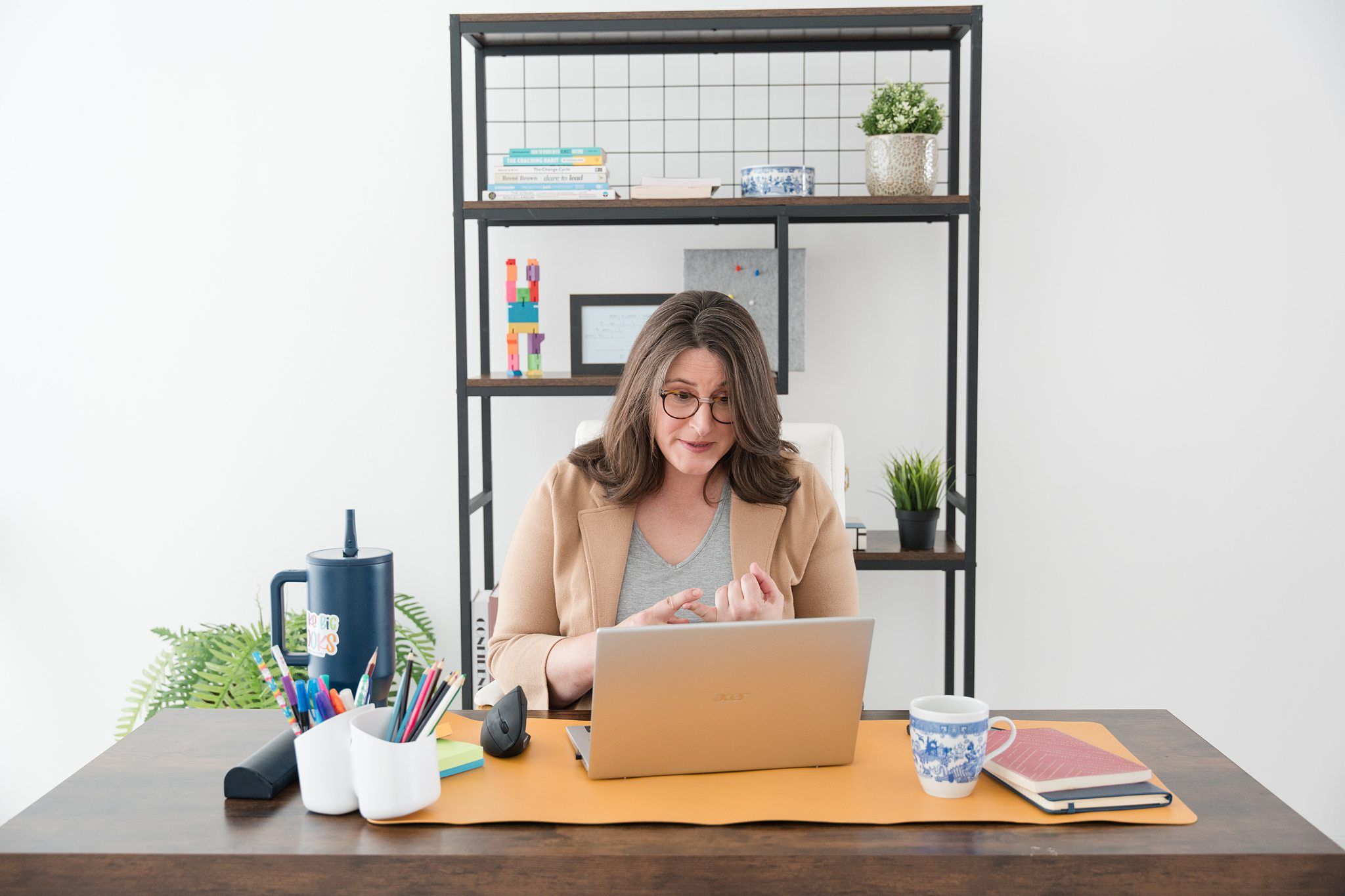 photo of a coach talking to laptop. best email marketing for photographers