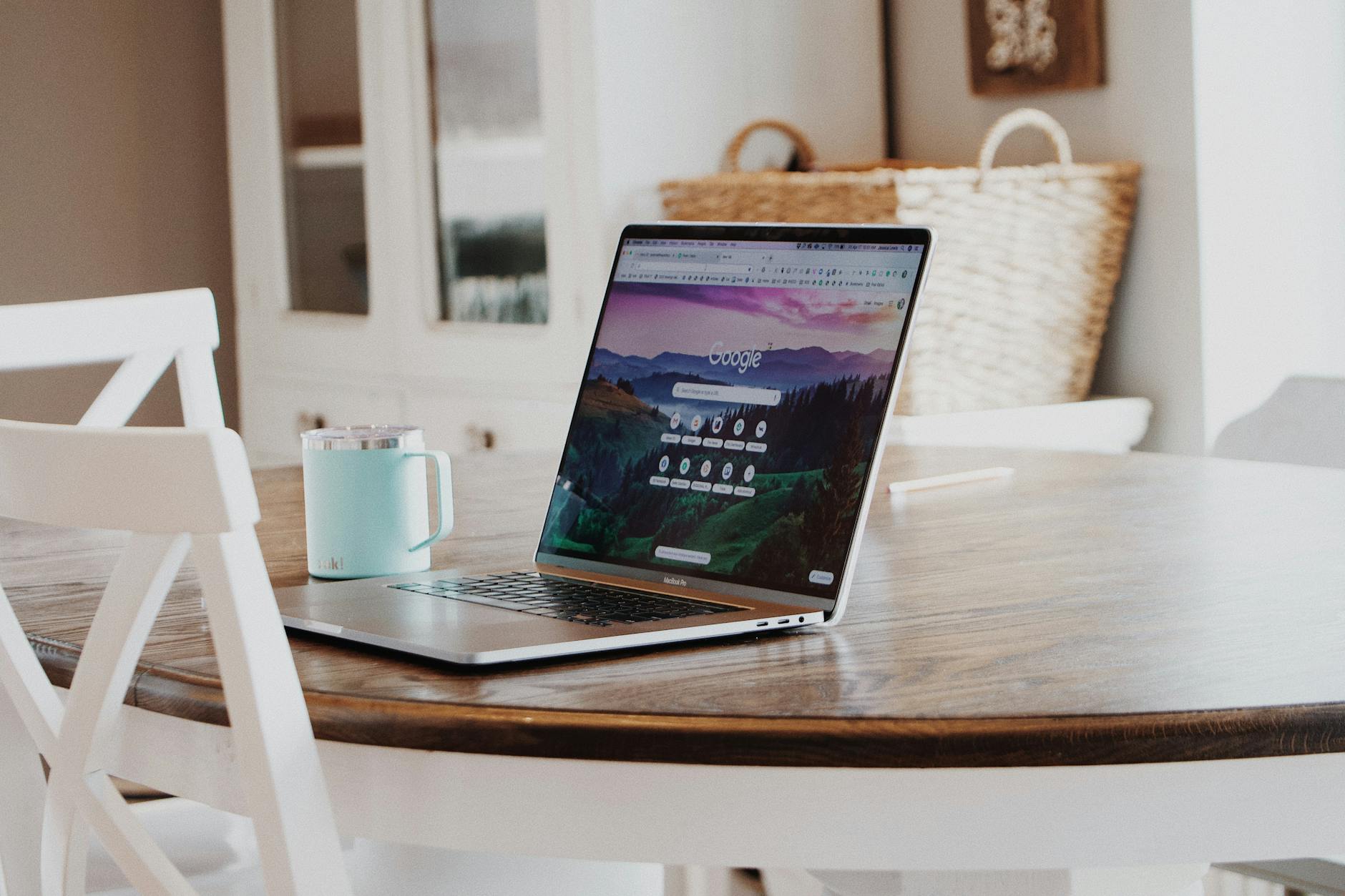 macbook on brown wooden table; how to drive traffic to your website