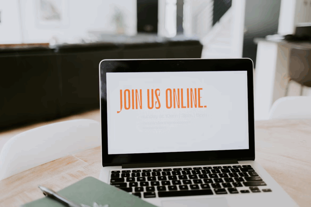 strengthen online presence with these strategies. Photo of a laptop with words "join us online" https://unsplash.com/photos/macbook-pro-on-brown-wooden-table-EeS69TTPQ18
