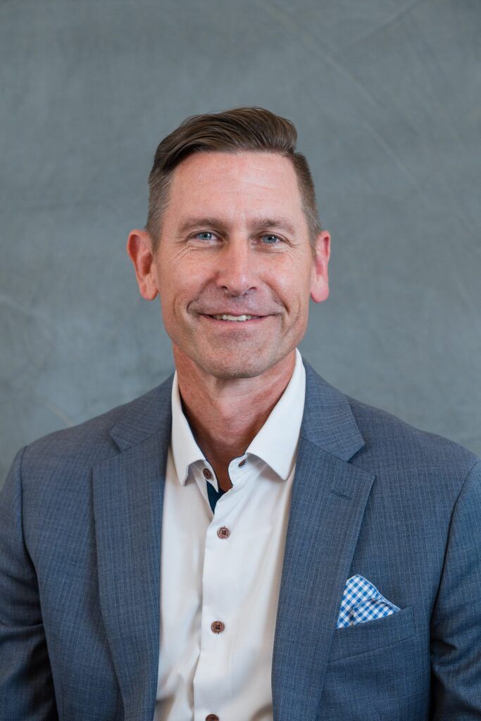 Senior Vice President looking at camera during executive leadership team headshot session - dallas mobile studio headshots